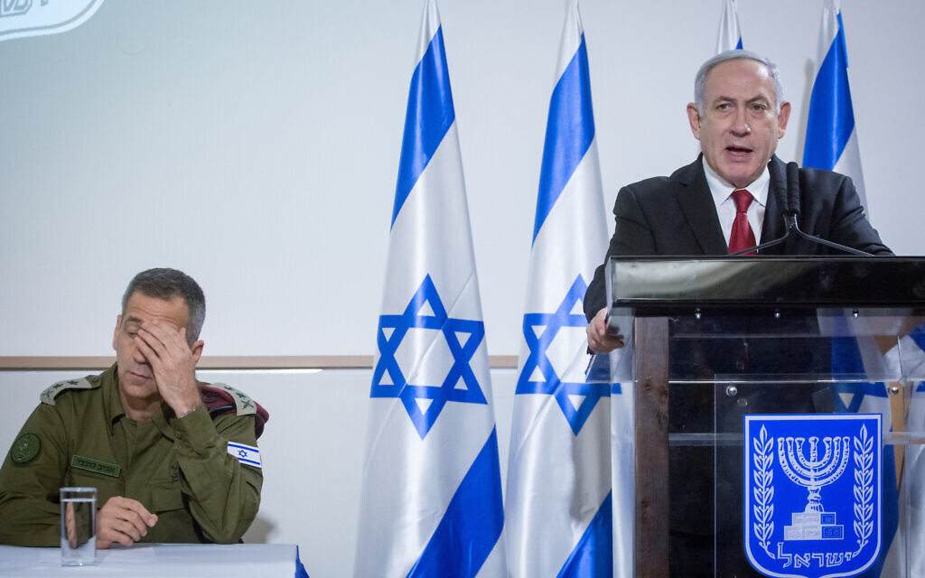 Prime Minister Benjamin Netanyahu and IDF Chief of Staff Aviv Kohavi at a press conference after a security cabinet meeting following an outbreak of violence with terror groups in the Gaza Strip, at the Kirya headquarters in Tel Aviv, on November 12, 2019. (Miriam Alster/Flash90) Prime Minister Benjamin Netanyahu and IDF Chief of Staff Aviv Kohavi at a press conference after a security cabinet meeting following an outbreak of violence with terror groups in the Gaza Strip, at the Kirya headquarters in Tel Aviv, on November 12, 2019. (Miriam Alster/Flash90)