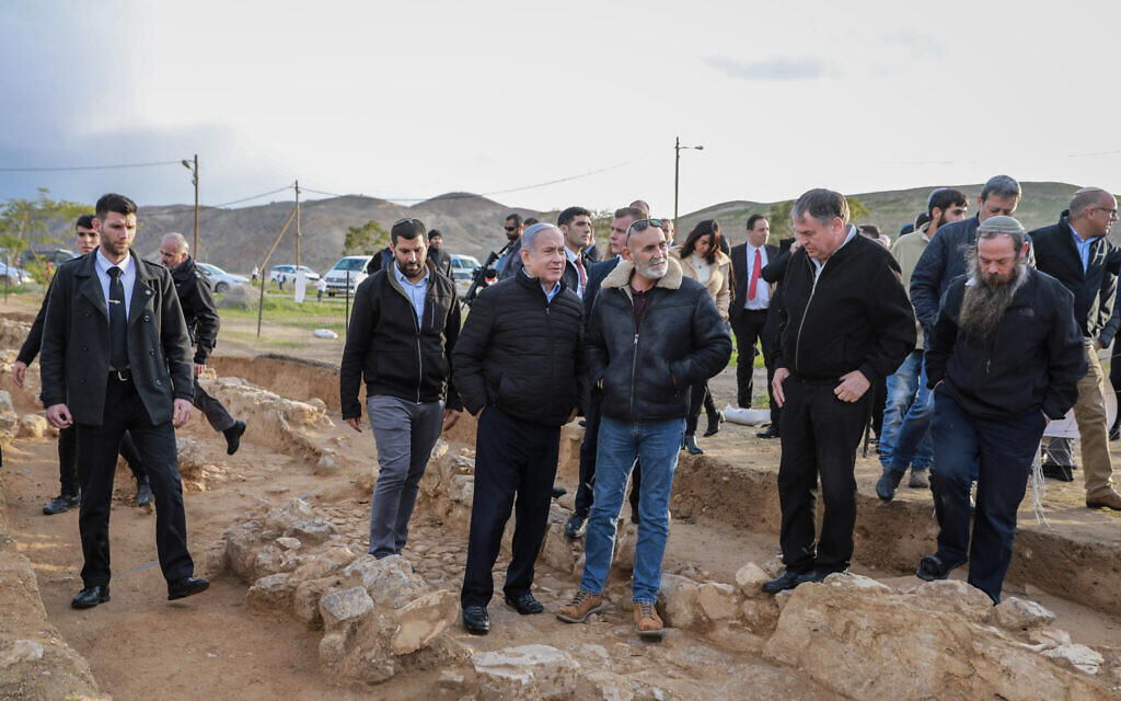 Prime Minister Benjamin Netanyahu (center left) and Yesha Council chairman David Elhayani seen during a tree planting event for the Jewish holiday of Tu Bishvat, in the West Bank settlement of Mevo'ot Yericho, in the Jordan Valley on February 10, 2020. (Flash90) Prime Minister Benjamin Netanyahu (center left) and Yesha Council chairman David Elhayani seen during a tree planting event for the Jewish holiday of Tu Bishvat, in the West Bank settlement of Mevo'ot Yericho, in the Jordan Valley on February 10, 2020. (Flash90)
