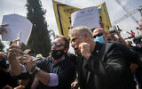 MK Yair Lapid arrives at a rally of self-employed and kindergarten owners calling for financial support from the government outside the Knesset in Jerusalem, on April 19, 2020 (Yonatan Sindel/Flash90)