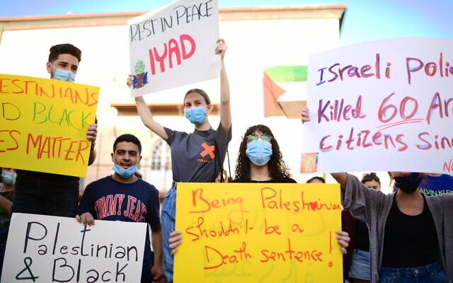 People protest against the police shooting of Palestinian Iyad Halak, in Tel Aviv-Jaffa, May 31, 2020. (Tomer Neuberg/Flash90) People protest against the police shooting of Palestinian Iyad Halak, in Tel Aviv-Jaffa, May 31, 2020. (Tomer Neuberg/Flash90)