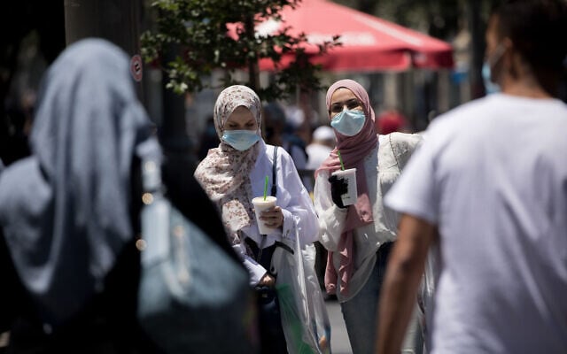 People walk with face masks on Jaffa Street in downtown Jerusalem on June 25, 2020. (Yonatan Sindel/Flash90) People walk with face masks on Jaffa Street in downtown Jerusalem on June 25, 2020. (Yonatan Sindel/Flash90)