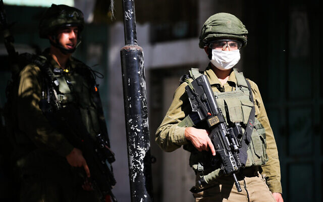 Israeli soldiers clash with Palestinians during a protest in the West Bank city of Hebron against Israel's annexation plans, June 26, 2020. (Wisam Hashlamoun/Flash90) Israeli soldiers clash with Palestinians during a protest in the West Bank city of Hebron against Israel's annexation plans, June 26, 2020. (Wisam Hashlamoun/Flash90)