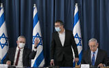 From left to right: Defense Minister Benny Gantz, the prime minister's chief of staff Asher Hayoun, and Prime Minister Benjamin Netanyahu at the weekly cabinet meeting, at the Foreign Ministry in Jerusalem on June 28, 2020. (Olivier Fitoussi/Flash90)