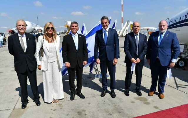Foreign Minister Gabi Ashkenazi (3L) greeting a Greek delegation led by Prime Minister Kyriakos Mitsotakis (3R) at Ben Gurion Airport, June 16, 2020. (Shlomi Amsalem/Foreign Ministry) Foreign Minister Gabi Ashkenazi (3L) greeting a Greek delegation led by Prime Minister Kyriakos Mitsotakis (3R) at Ben Gurion Airport, June 16, 2020. (Shlomi Amsalem/Foreign Ministry)