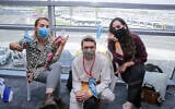 Three new immigrants after arriving in Israel on June 9, 2020. (Yonit Schiller/Courtesy of Nefesh B'Nefesh)