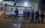 Video aired by the Kan public broadcaster on June 4, 2020, shows police arresting a suspect in connection to the assault on former Likud MK Yehudah Glick in East Jerusalem's Wadi al-Joz neighborhood. (Screen capture: Twitter)