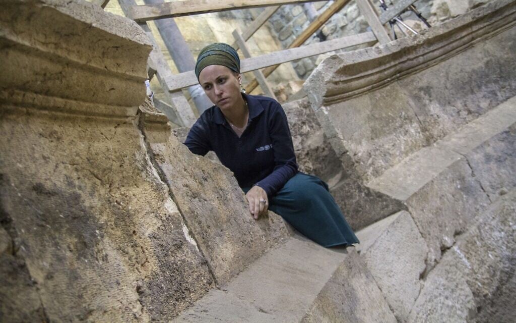 Tehillah Liberman at an unfinished, 2nd-century CE Roman theater. (Yaniv Berman/Israel Antiquities Authority)
