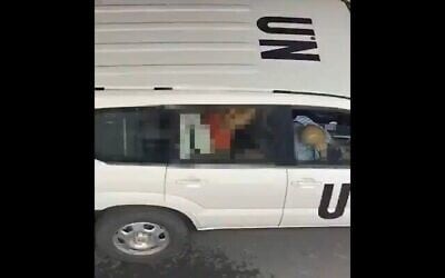 A woman straddles a man in the back of a United Nations vehicle in a video clip that was shared widely online on June 26, 2020. The video is believed to be from Tel Aviv and the image has been pixelated by the Times of Israel. (Screenshot/Twitter)
