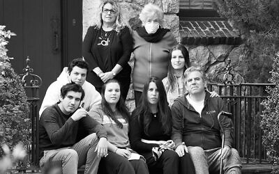 New Rochelle resident Lawrence Garbuz, lower right, was the first patient diagnosed with coronavirus in New York. He's still recovering, but now he's home with his family. (Stan Weiss via JTA)