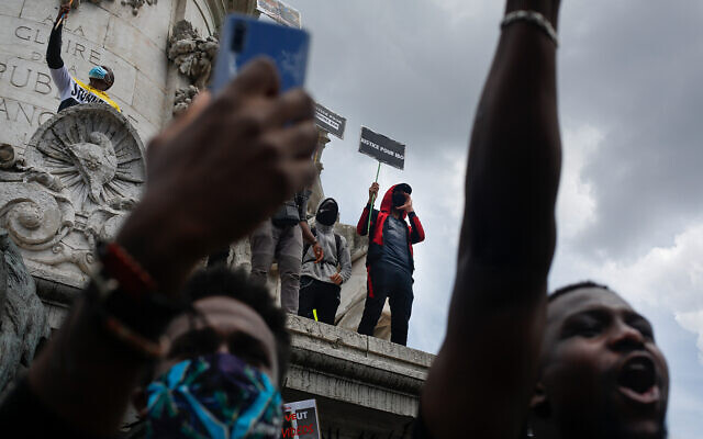 People gather at Place de la Republique for a march against police brutality and racism in Paris, France, June 13, 2020. (AP/Thibault Camus) People gather at Place de la Republique for a march against police brutality and racism in Paris, France, June 13, 2020. (AP/Thibault Camus)