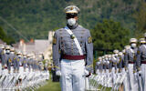 United States Military Academy graduating cadets wear face masks as they stand next to their socially-distanced seats during commencement ceremonies in West Point, New York, June 13, 2020. (AP/John Minchillo, Pool)
