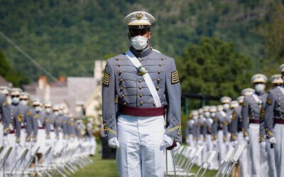 United States Military Academy graduating cadets wear face masks as they stand next to their socially-distanced seats during commencement ceremonies in West Point, New York, June 13, 2020. (AP/John Minchillo, Pool)