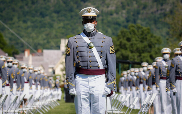 United States Military Academy graduating cadets wear face masks as they stand next to their socially-distanced seats during commencement ceremonies in West Point, New York, June 13, 2020. (AP/John Minchillo, Pool) United States Military Academy graduating cadets wear face masks as they stand next to their socially-distanced seats during commencement ceremonies in West Point, New York, June 13, 2020. (AP/John Minchillo, Pool)