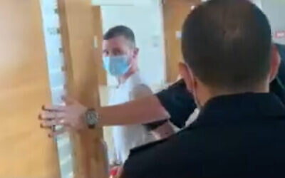 Shahar Rimoni, accused of raping a 10-year-old girl, appears in a Haifa court. (Screenshot/Walla news)
