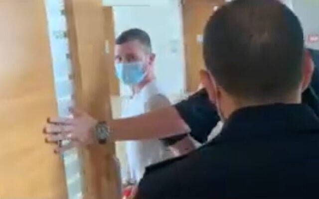Shahar Rimoni, accused of raping a 10-year-old girl, appears in a Haifa court. (Screenshot/Walla news) Shahar Rimoni, accused of raping a 10-year-old girl, appears in a Haifa court. (Screenshot/Walla news)