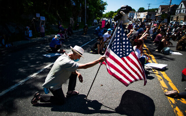 Demonstrators kneel during a solidarity protest for George Floyd in West Point, New York, June 13, 2020. (AP/Eduardo Munoz Alvarez) Demonstrators kneel during a solidarity protest for George Floyd in West Point, New York, June 13, 2020. (AP/Eduardo Munoz Alvarez)