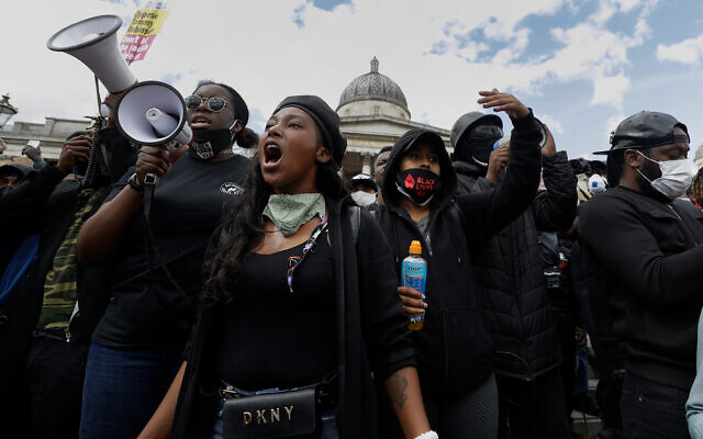 Black Lives Matter supporters during a protest at Trafalgar Square in central London, June 13, 2020. (AP/Kirsty Wigglesworth) Black Lives Matter supporters during a protest at Trafalgar Square in central London, June 13, 2020. (AP/Kirsty Wigglesworth)