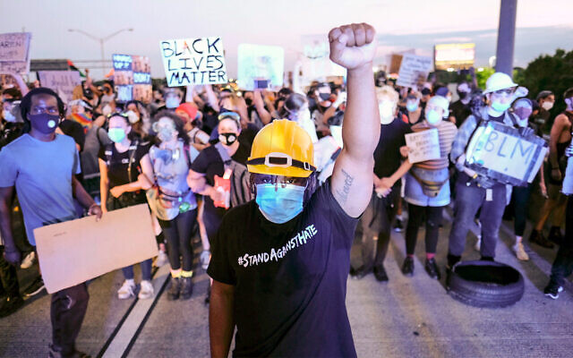 Demonstrators shut down an interstate after the police shooting of Rayshard Brooks in Atlanta, Georgia, June 13, 2020. (Ben Gray/Atlanta Journal-Constitution via AP) Demonstrators shut down an interstate after the police shooting of Rayshard Brooks in Atlanta, Georgia, June 13, 2020. (Ben Gray/Atlanta Journal-Constitution via AP)