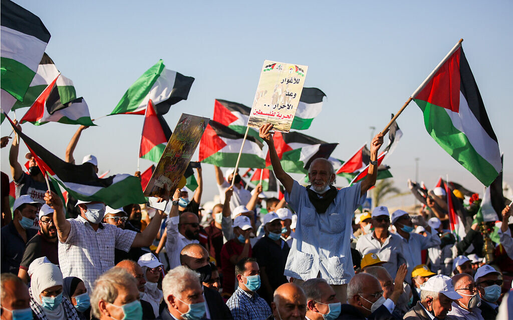 Thousands of Palestinians attend a rally against Israel's plan to annex parts of the West Bank, in the West Bank city of Jericho, June 22, 2020. (Flash90) Thousands of Palestinians attend a rally against Israel's plan to annex parts of the West Bank, in the West Bank city of Jericho, June 22, 2020. (Flash90)
