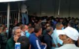 Palestinian workers on their way to work in Israel, at Bethlehem's Checkpoint 300 in the West Bank, June 2020. (Screenshot: Channel 12)