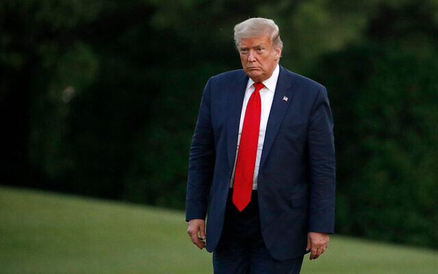 US President Donald Trump walks on the South Lawn of the White House in Washington, May 30, 2020. (AP/Patrick Semansky) US President Donald Trump walks on the South Lawn of the White House in Washington, May 30, 2020. (AP/Patrick Semansky)