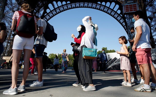 People line up to visit the Eiffel Tower, in Paris, June 25, 2020. (AP Photo/Thibault Camus) People line up to visit the Eiffel Tower, in Paris, June 25, 2020. (AP Photo/Thibault Camus)