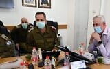 Defense Minister Benny Gantz, right, meets with IDF Chief of Staff Aviv Kohavi, center, and Northern Command chief Amir Baram in northern Israel on June 2, 2020. (Ariel Hermoni/Defense Ministry)