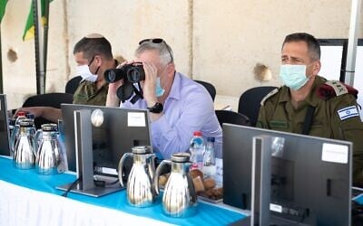 Defense Minister Benny Gantz, center, surveys the northern border with IDF Chief of Staff Aviv Kohavi, right, in northern Israel on June 2, 2020. (Israel Defense Forces)