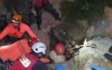 Police and rescue workers extract three men who got stuck in a cave near the Galilee town of Iksal while searching for treasure, June 6, 2020. (Israel Police)
