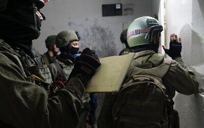 Israeli troops measure the home of a Palestinian man suspected of killing a soldier with a break last month, in the West Bank village of Yabed on June 11, 2020. (Israel Defense Forces)