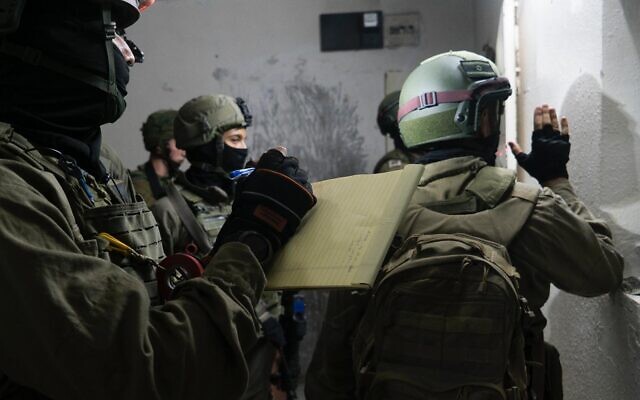 Israeli troops measure the home of a Palestinian man suspected of killing a soldier with a break last month, in the West Bank village of Yabed on June 11, 2020. (Israel Defense Forces) Israeli troops measure the home of a Palestinian man suspected of killing a soldier with a break last month, in the West Bank village of Yabed on June 11, 2020. (Israel Defense Forces)