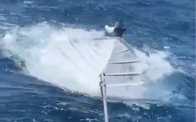Naval police tow the boat which overturned off the coast of Eilat during a family activity, June 26, 2020 (Screen grab/Israel Police) Naval police tow the boat which overturned off the coast of Eilat during a family activity, June 26, 2020 (Screen grab/Israel Police)