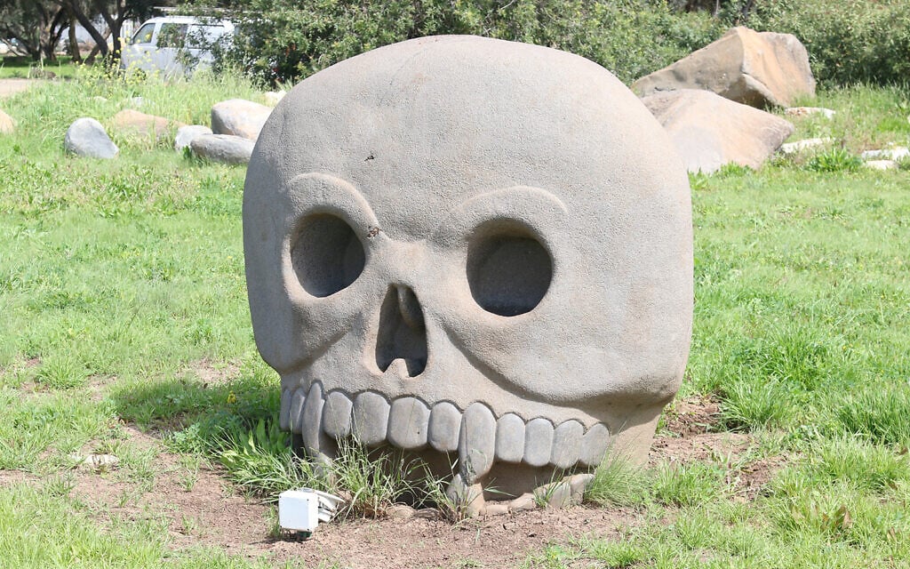 Artwork by Dagan Shkovsky in Kibbutz Ein Carmel. Shkovsky said he created the garden to make visitors feel good. "Instead of money, I do good works," he said. (Shmuel Bar-Am)