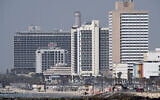 Hotels on Tel Aviv's coastline are seen from Jaffa on March 26, 2020 (Gili Yaari /Flash90)