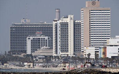 Hotels on Tel Aviv's coastline are seen from Jaffa on March 26, 2020 (Gili Yaari /Flash90)