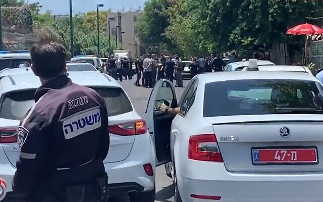 The scene in Jaffa where a man was shot dead and a 12-year-old critically injured, June 16, 2020 (Screen grab/Ynet) The scene in Jaffa where a man was shot dead and a 12-year-old critically injured, June 16, 2020 (Screen grab/Ynet)