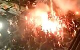 Maccabi Tel Aviv soccer fans celebrate team's victory along with players, June 3, 2020 (Screen grab/Walla)