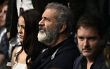 Mel Gibson at a UFC event with his partner Rosalind Ross in Las Vegas, Dec. 14, 2019. (Chris Unger/Zuffa LLC/Getty Images via JTA)