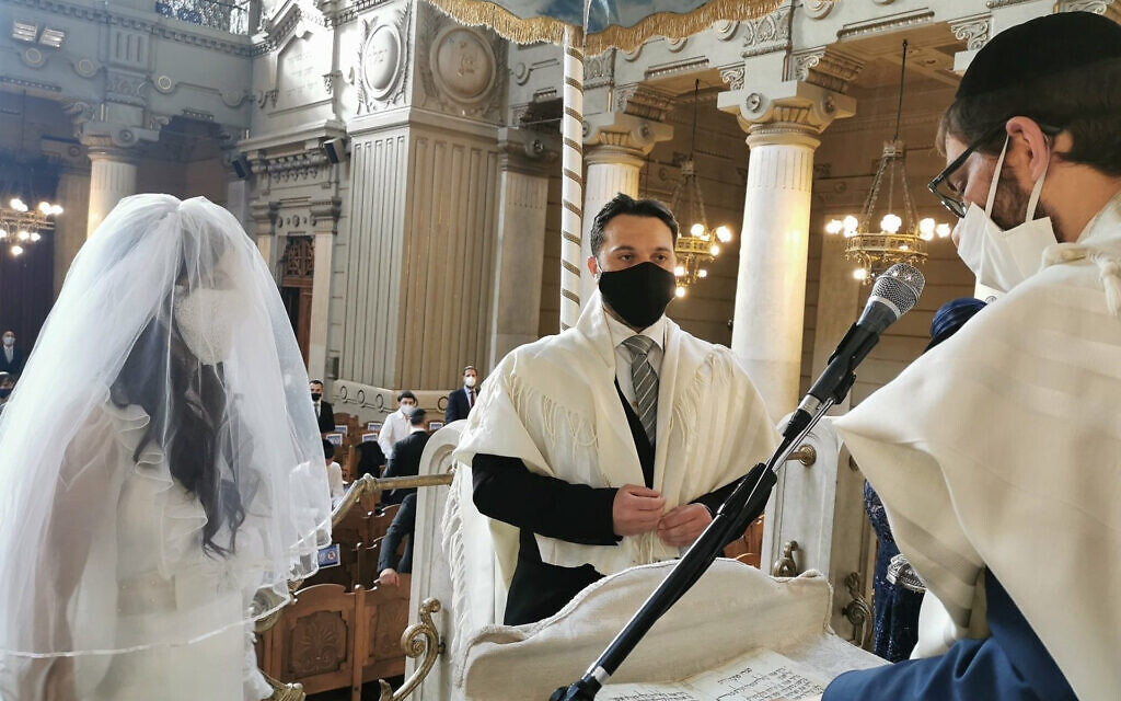 Illustrative: Rabbi Menachem Lazar, right, officiates at the wedding of Marco Del Monte and Elinor Hanoka at the Great Synagogue of Rome, June 7, 2020. (Courtesy of Chabad Piazza Bologna via JTA) Illustrative: Rabbi Menachem Lazar, right, officiates at the wedding of Marco Del Monte and Elinor Hanoka at the Great Synagogue of Rome, June 7, 2020. (Courtesy of Chabad Piazza Bologna via JTA)