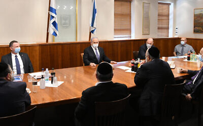 Prime Minister Benjamin Netanyahu meets with Health Minister Yuli Edelstein, Public Security Minister Amir Ohana, Interior Minister Aryeh Deri and ultra-Orthodox MKs to discuss the government's coronavirus response, on July 13, 2020. (Amos Ben Gershom/GPO)