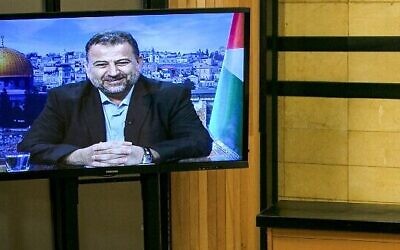 Senior Fatah official Jibril Rajoub, right, in the West Bank city of Ramallah, at a video conference with deputy Hamas chief Saleh al-Arouri, who is in Beirut, July 2, 2020. (Abbas Momani/AFP)