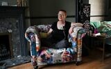 British forensic psychiatrist Jenny Judge who is a long term sufferer with post-coronavirus (Covid-19) symptoms, wears a heart monitor as she poses at her home in West Ewell, Surrey, south-east England,  July 8, 2020. (GLYN KIRK/AFP)
