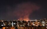 Illustrative: Smoke billows following an alleged Israeli airstrike south of Damascus, Syria, on July 20, 2020. (AFP)