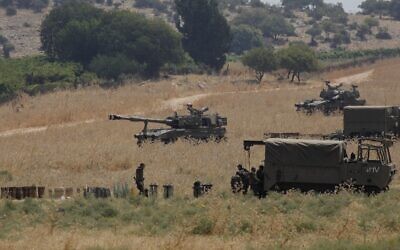 Armored vehicles and 155 mm self-propelled howitzers are deployed in the Upper Galilee in northern Israel on the border with Lebanon on July 27, 2020. (JALAA MAREY / AFP) Armored vehicles and 155 mm self-propelled howitzers are deployed in the Upper Galilee in northern Israel on the border with Lebanon on July 27, 2020. (JALAA MAREY / AFP)