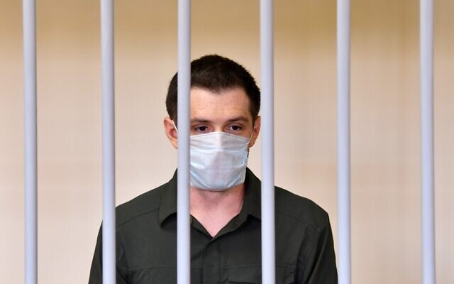 US ex-marine Trevor Reed, charged with attacking police, stands inside a defendants' cage during his verdict hearing at Moscow's Golovinsky district court on July 30, 2020. (Dimitar DILKOFF / AFP) US ex-marine Trevor Reed, charged with attacking police, stands inside a defendants' cage during his verdict hearing at Moscow's Golovinsky district court on July 30, 2020. (Dimitar DILKOFF / AFP)