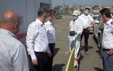 Health officials observe a pilot program for a testing method that returns COVID-19 results in 15 minutes, in Lod on July 15, 2020 (Courtesy)