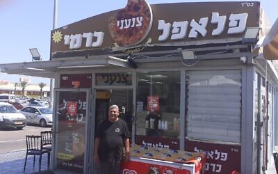 Falafel vendor Yuval Carmi in front of his store, June 9, 2020. (Anat Peled/Times of Israel)