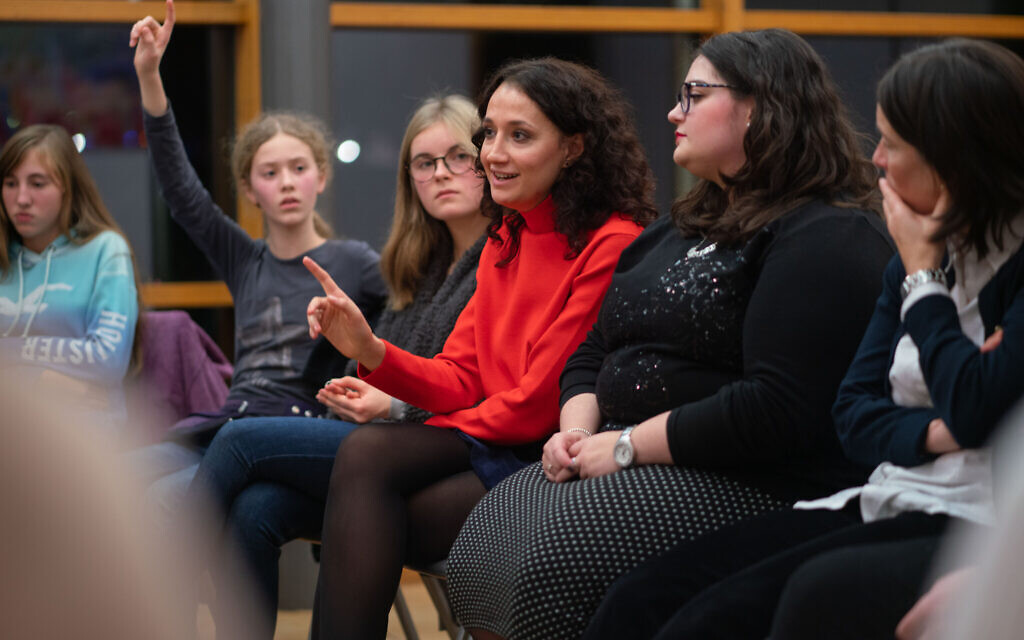 Illustrative: Volunteers with a program now called Meet a Jew talk with non-Jewish students at a school in Frankfurt, November 5, 2019. (Frank Rumpenhorst/picture alliance via Getty Images/ via JTA)