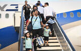 Illustrative: New immigrants from North America arrive on a flight arranged by the Nefesh B'Nefesh organization at Ben Gurion Airport, on August 14, 2019. (Flash90/ File)