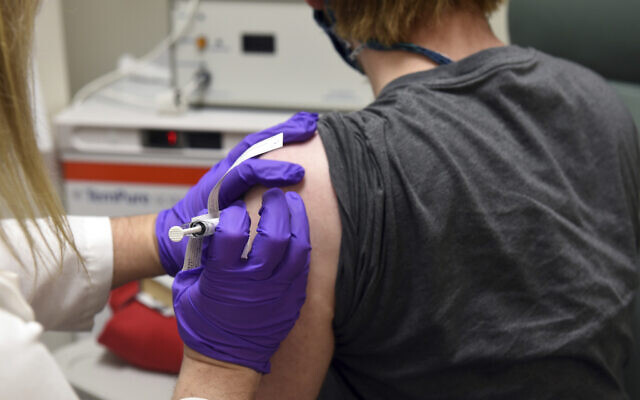 Illustrative: The first patient enrolled in Pfizer's COVID-19 coronavirus vaccine clinical trial at the University of Maryland School of Medicine in Baltimore, receives an injection, May 4, 2020. (University of Maryland School of Medicine via AP) Illustrative: The first patient enrolled in Pfizer's COVID-19 coronavirus vaccine clinical trial at the University of Maryland School of Medicine in Baltimore, receives an injection, May 4, 2020. (University of Maryland School of Medicine via AP)